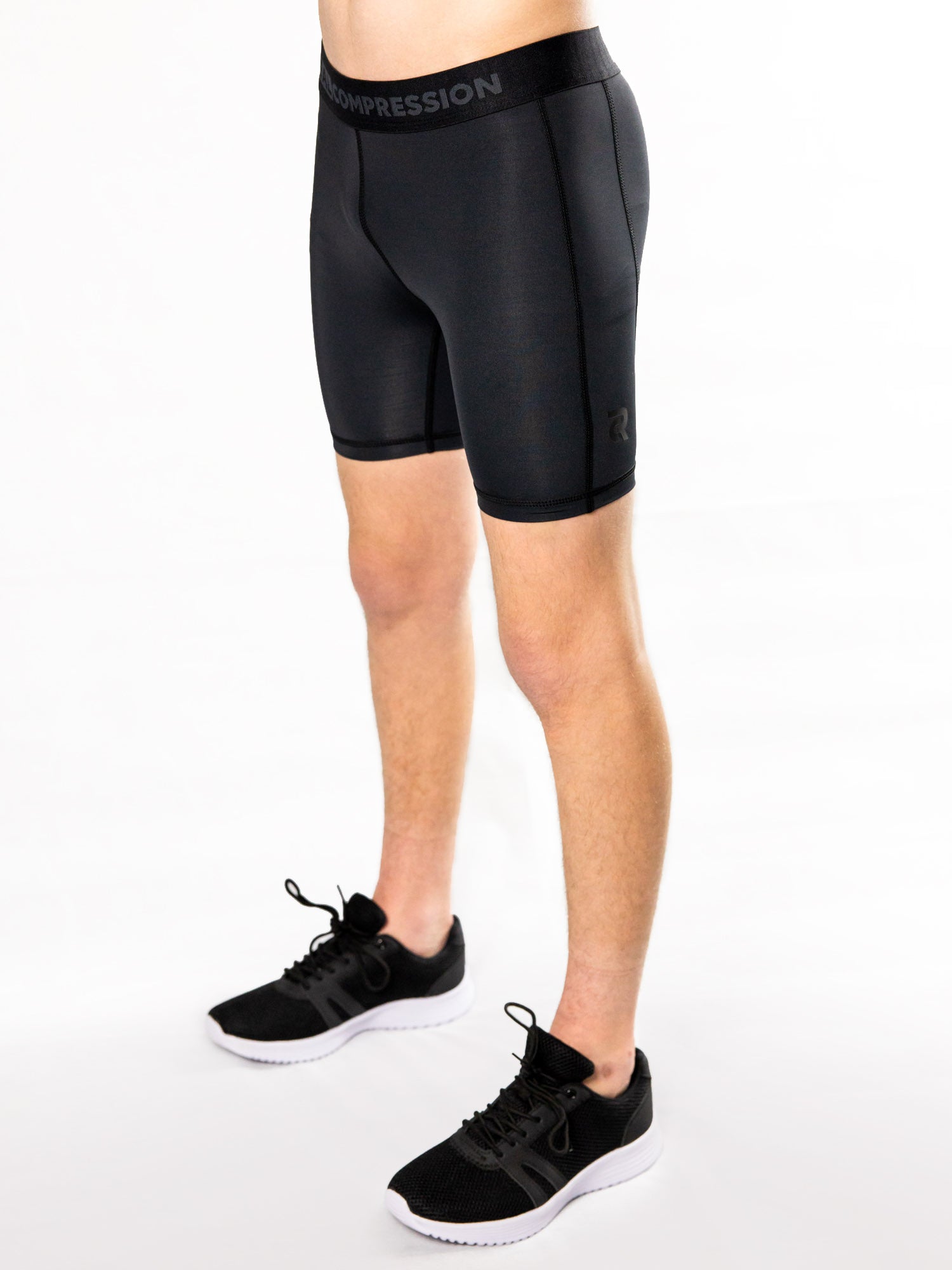 Black youth compression half shorts – side view
